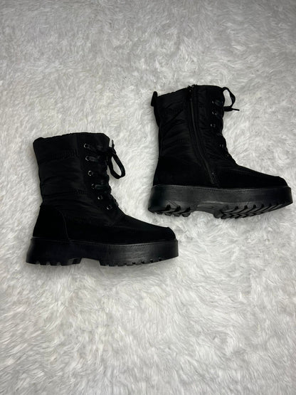 Botin impermeable negro media caña
